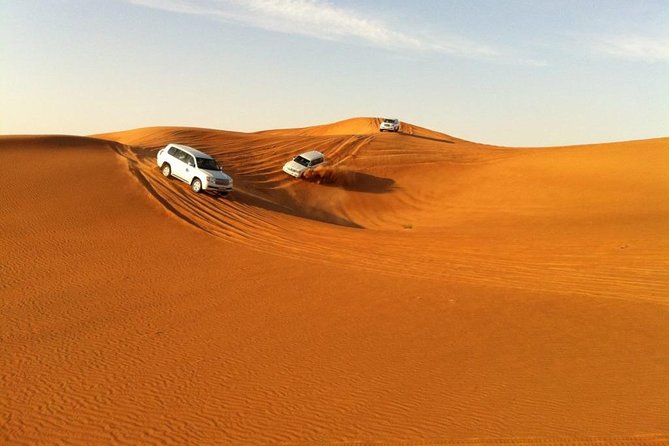 Abu Dhabi 4x4 Desert Safari BBQ Dinner , Camel Ride , Belly Dance - Dune bashing for 30 to 40 minutes