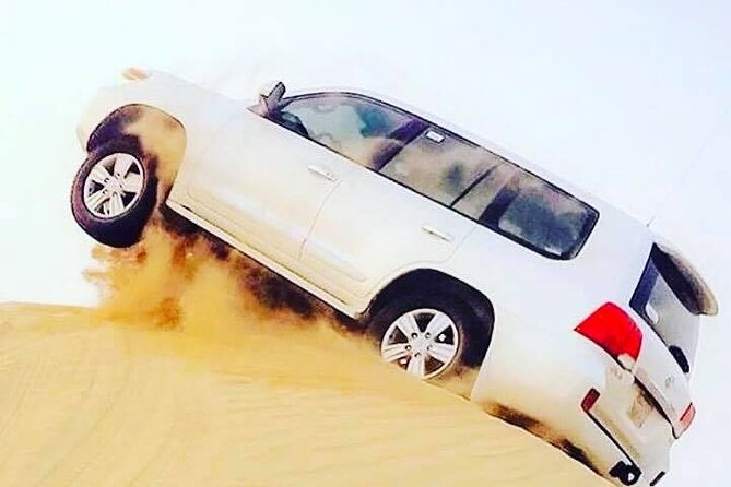 Abu Dhabi: 7-Hours Desert Safari with BBQ, Camel Ride & Sandboarding - Sunset photos and traditional camp touches