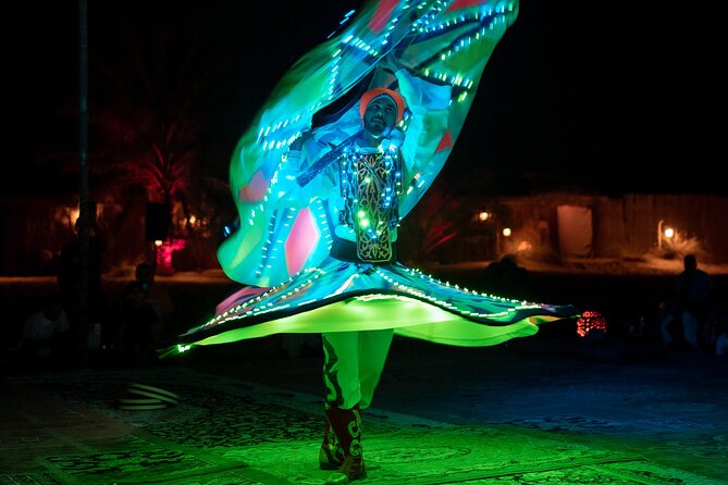 Abu Dhabi: 7-Hours Desert Safari with BBQ, Camel Ride & Sandboarding - Henna, costumes, and falcon photographs