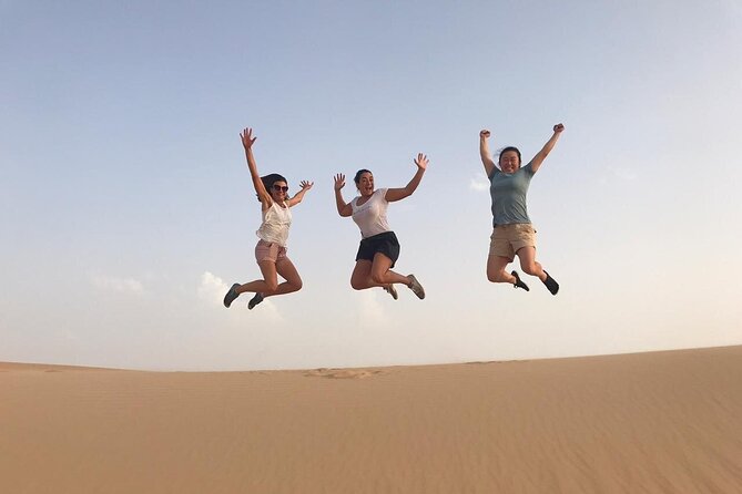 Abu Dhabi: 7-Hours Desert Safari with BBQ, Camel Ride & Sandboarding - The camel farm stop and the short ride