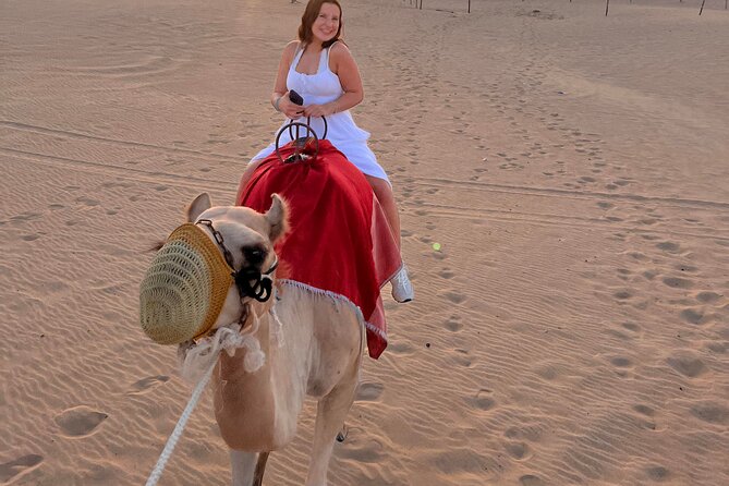 Abu Dhabi Desert Safari with Live Entertainment and Live BBQ - Sandboarding gives the camp more to do