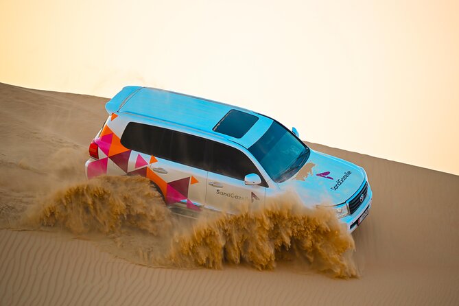 Abu Dhabi Evening Desert Safari - Dune bashing Camel ride and BBQ - Dinner and Entertainment Under the Night Sky