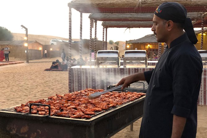 Abu Dhabi Evening Desert Safari with BBQ Dinner and all Camp Activities - Sandboarding and Henna at the Dunes