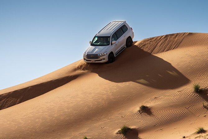 Adrenaline combo : Desert activities + ATV or Quad bike option - Sandboarding from a high dune