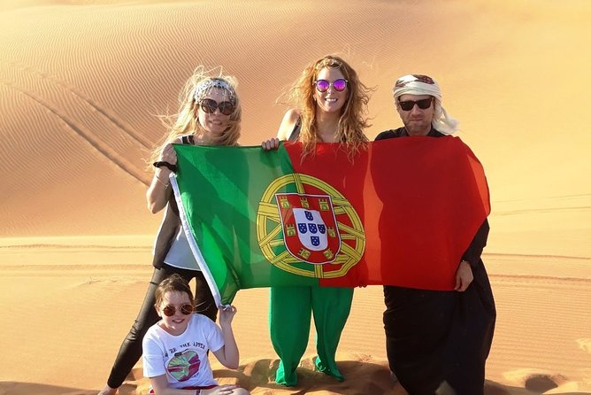 Afternoon Dune Drive Safari with SunSet Photo & Sand Boarding - Al Madam, sandboarding, and the sunset pause