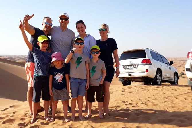 Best Dubai Desert Safari with Buffet Dinner,Sand Boarding & Shows - Leaving Dubai for the red dunes