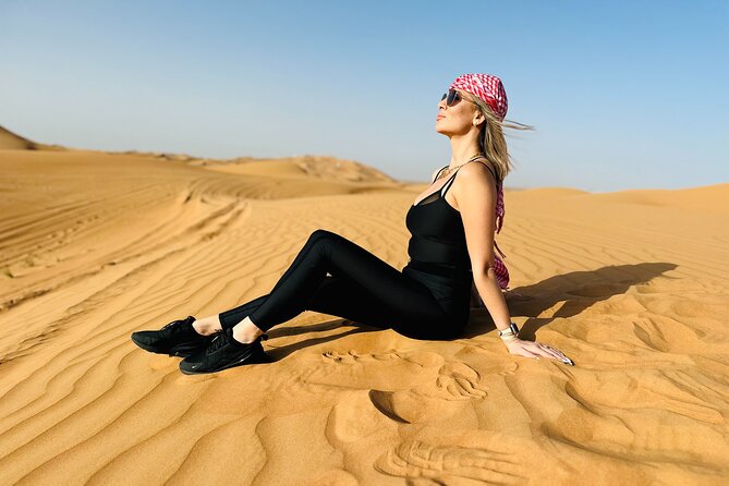 Best Dubai Desert Safari with Buffet Dinner,Sand Boarding & Shows - Sandboarding without an extra charge