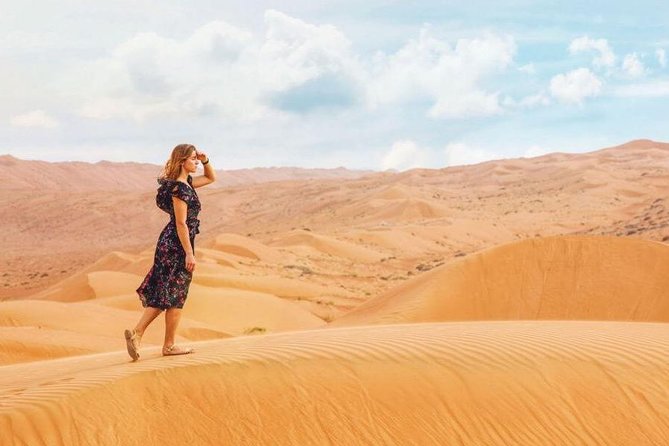 Camel Trekking and Morning Safari with Sand Boarding - Sandboarding from a high dune