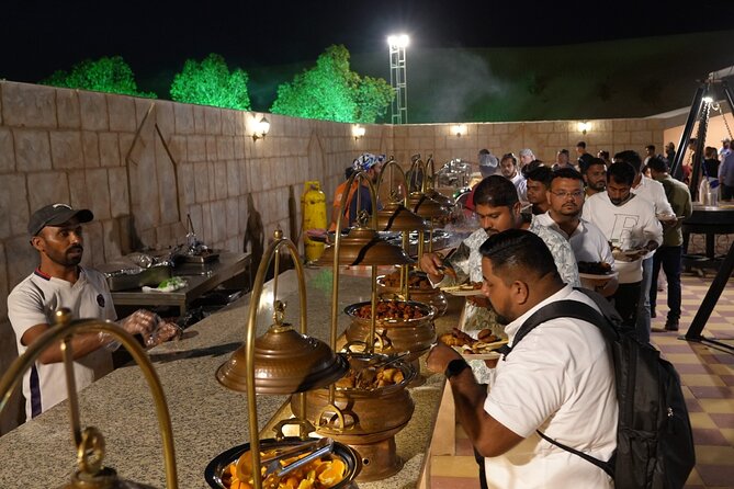 Deluxe Premium Dubai Desert Safari with Camel Ride, and Live Show - Sand boarding, camel riding, and camp activities