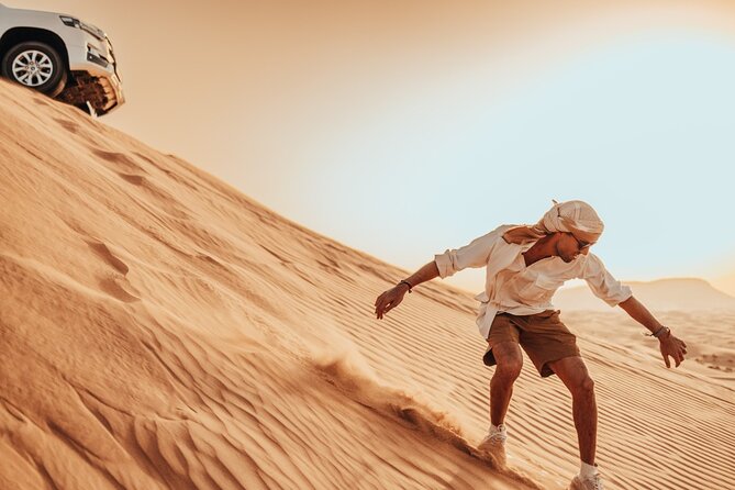 Deluxe Sunset Desert Safari: SandSurfing, Camel Ride & BBQ dinner - Leaving Dubai for the Red Dunes