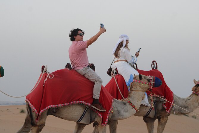 Desert Adventure: Sunset Safari, BBQ Feast & Sandboarding Thrill - Sunset photographs and a quieter camel ride