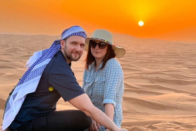 Desert Safari BBQ dinner, Camel ride & sandboarding from Dubai - Henna, Arabic clothing, and camp photographs