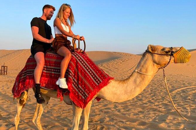 Desert Safari Dubai Tour with Dune Bashing, Camel Ride, & BBQ - From Dubai hotels to the open desert
