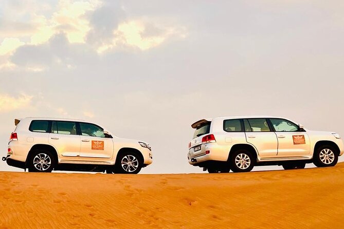 Desert Safari Dubai with BBQ Dinner & Camel Ride - Sandboarding on soft desert slopes