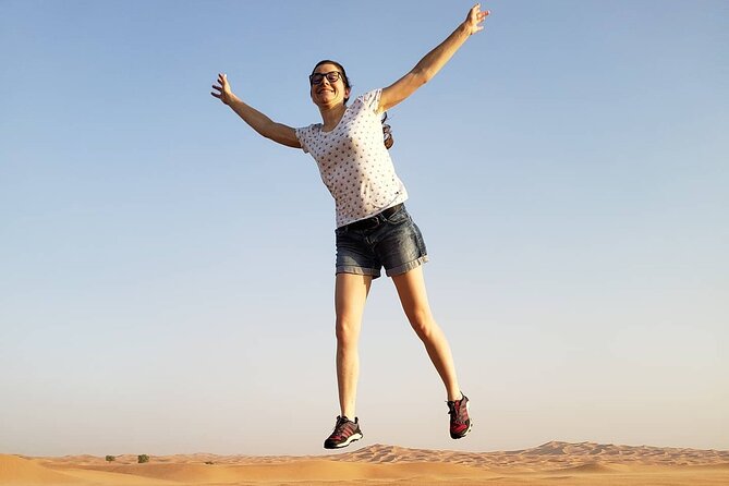 Desert Safari Dubai with Buffet Dinner & 3 live shows - Sandboarding and sunset photos