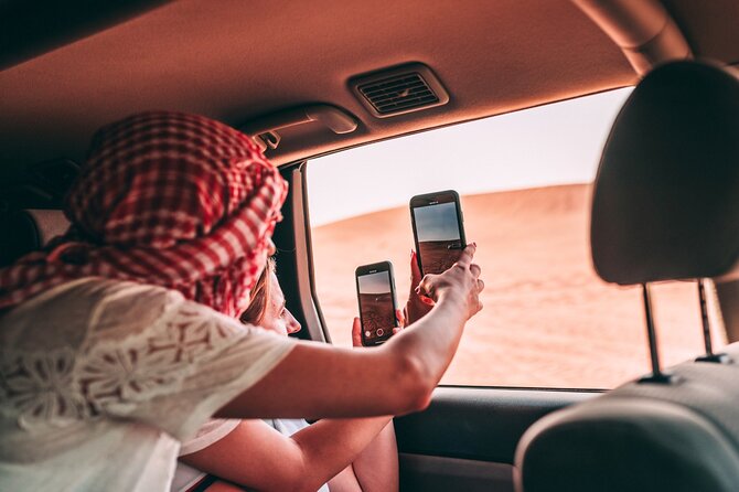 Desert Safari Dubai with Dune Bashing, Activities and Dinner - Sandboarding on the dunes