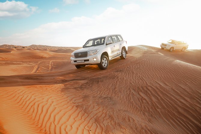 Desert Safari Dubai with Dune Bashing, Sandboarding, Camel Ride, 5 Shows, Dinner - BBQ dinner in a Bedouin-style camp