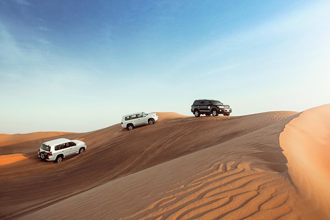 Desert Safari Dubai with Dune Bashing, Sandboarding, Camel Ride, 5 Shows, Dinner - Sandboarding and the camel ride