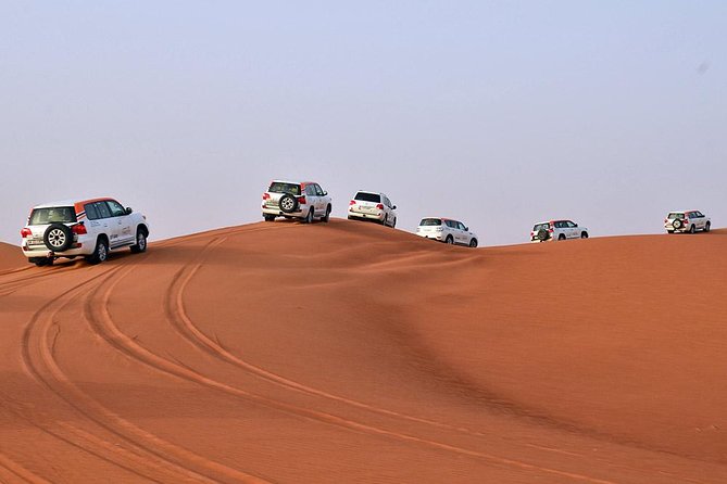 Desert Safari in 4X4 through Lahbab Desert with BBQ Dinner - Camel Riding, Henna, and Shisha at Camp