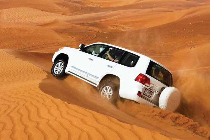 Desert Safari Redsand Dunes with BBQ Dinner in Dubai - Sunset photographs among the dunes