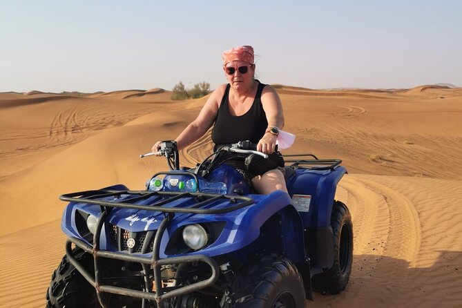 Desert Safari With 30 Mins Of Quad Bike Tour Camel Ride And BBQ - Camel ride and sandboarding between the thrills
