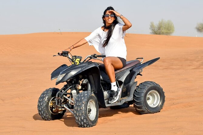 Desert Safari With 30 Mins Of Quad Bike Tour Camel Ride And BBQ - Sunset at the Bedouin-style desert camp