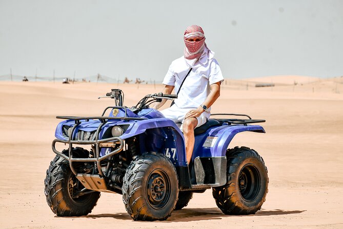 Desert Safari With BBQ Dinner, Quad Bike & Camel Ride from Dubai - Dune bashing across the evening sand