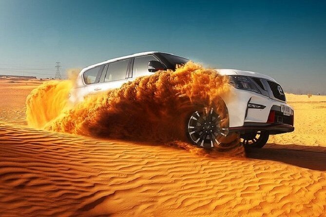 Desert Safari With BBQ Dinner, Quad Ride And And Sand-boarding - Dune bashing across the red dunes