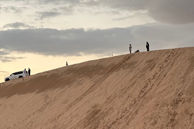 Desert Safari with Dune Bashing and Camel Ride plus Sand Boarding - The sunset photo stop