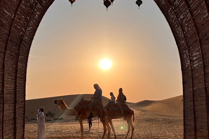 Desert Safari with Dune Bashing and Camel Ride plus Sand Boarding - Arriving at the Bedouin-style camp