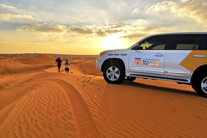 Desert Safari with Dune Bashing and Dinner In Dubai - Sunset over the sand and time for photographs