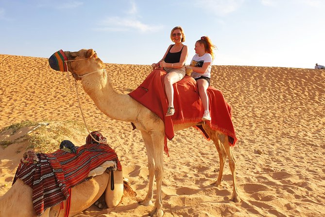 Desert Safari with Quad Bike, 4x4 Dune Bashing and Camel Ride - Quad biking across the sand