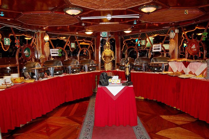 Dhow Cruise Dinner with Entertainment - Boarding the wooden dhow near the creek