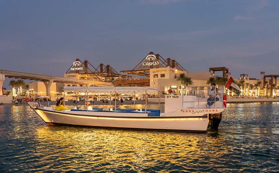 Dubai: Abra Boat Tour in Atlantis, Palm, Ain Dubai & Marina - Jumeirah Beach Residence and Ain Dubai at sunset