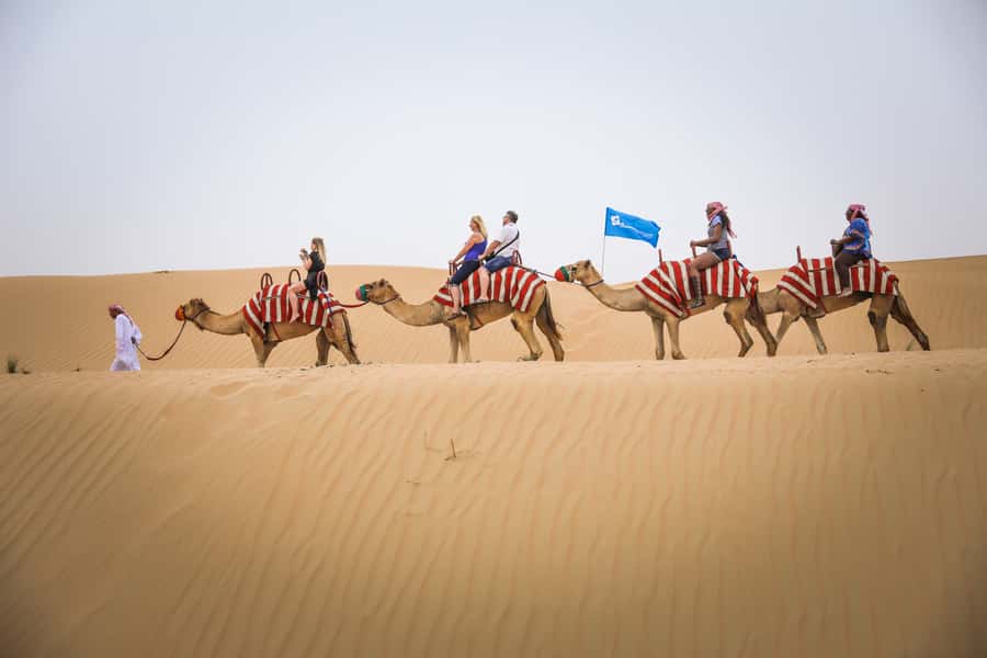 Dubai: Adventure Quad Bike Safari, Camel Ride & Refreshment - Sunset, drinks, and a cool tent