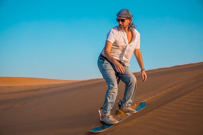 Dubai: Adventure Quad Bike Safari, Camel Ride & Refreshments - From Dubai hotels to the red dunes of Lahbab