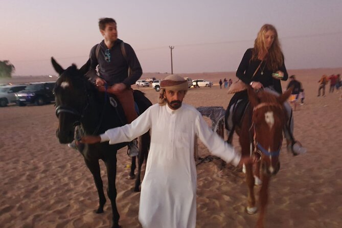Dubai: All Inclusive Desert Safari with ATV, Camel, Horse ride, Vip & more - Al Awir camp: coffee, henna, falcons, and local dress