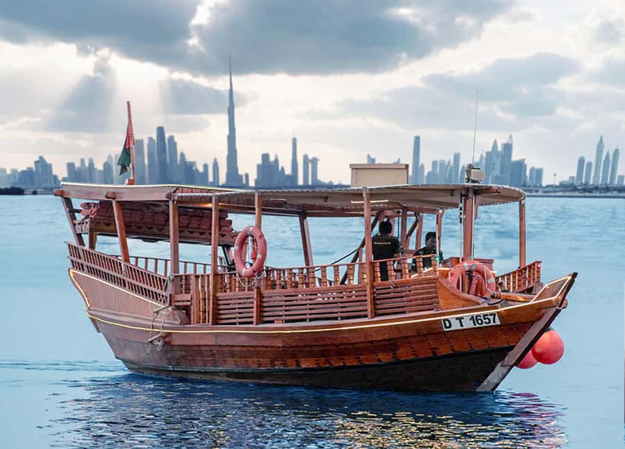 Dubai: Burj Khalifa Sunset on an Abra - A traditional wooden abra on the Dubai Water Canal