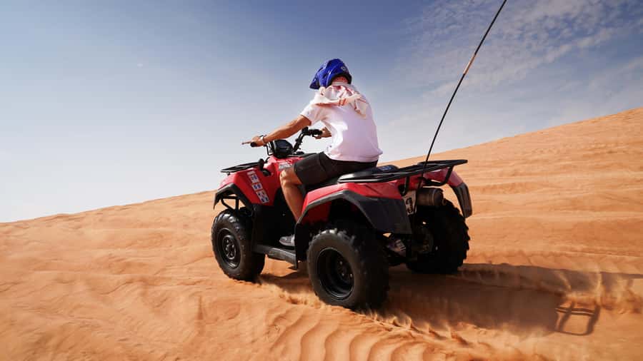 Dubai Desert Adventure: Red Dunes Guided Quad/Polaris & BBQ - Sandboarding and the desert sunset