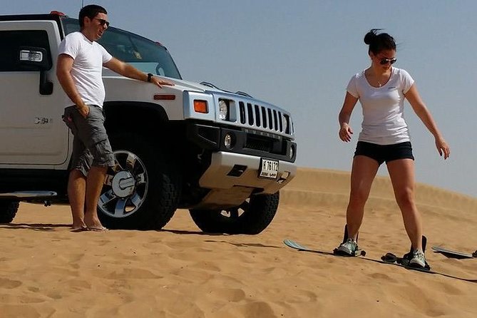 Dubai Desert Morning Tour in 4WD Vehicle: Camel Ride, Quad Bike Tour, Sandboarding, and Camel Farm - Guides, photography, and service