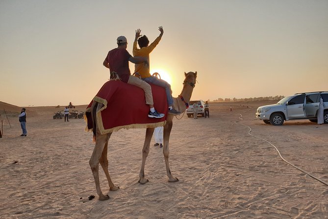 Dubai: Desert Safari 4x4 Dune with Camel Riding and Sandboarding - Sandboarding and sunset photographs