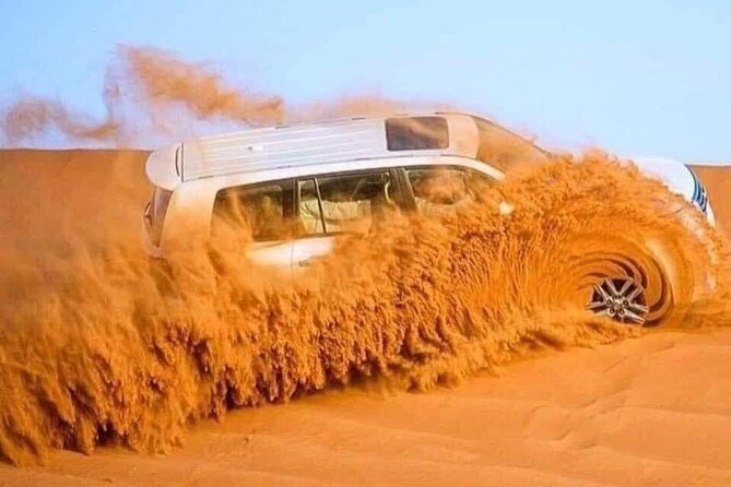 Dubai Desert Safari Adventure with Premium BBQ Dinner - Sunset photos in the sand