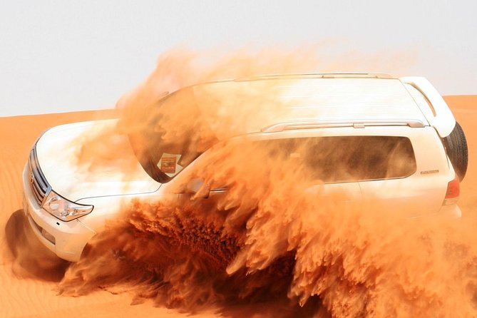 Dubai Desert Safari and Quad Bike Ride with Buffet Dinner - Dune bashing across the red sand