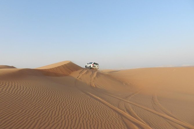 Dubai Desert Safari, ATV open desert, Camel ride, Shows & BBQ - Sandboarding is simple, but worth trying