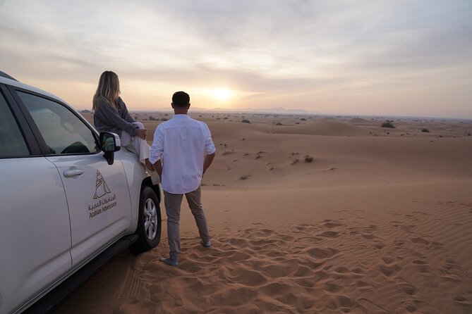 Dubai Desert Safari: Camel Ride, Sandboarding, BBQ & House Drinks - Dinner under the stars, with house drinks included