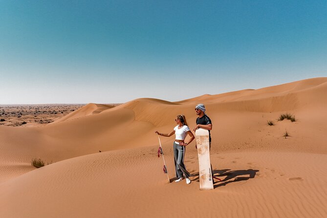 Dubai Desert Safari: Camel Ride, Sandboarding, BBQ & House Drinks - Sunset, falcons, and the best photo stop