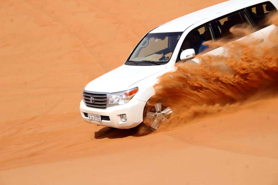 Dubai: Desert Safari, Camel Ride, Sandboarding, Quad Bike - Sandboarding: short, simple, and surprisingly fun