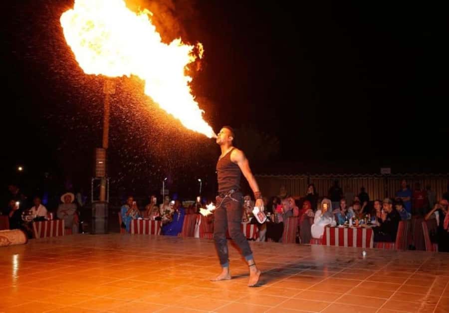 Dubai: Desert Safari Camel Riding, Sandboarding & BBQ Dinner - Sandboarding on the dunes