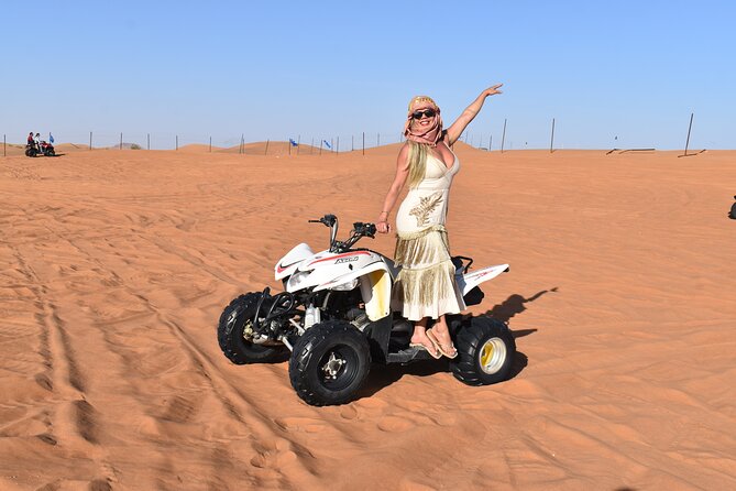 Dubai: Desert Safari, Quad bike and Sand boarding with BBQ Dinner - Sunset over the red dunes