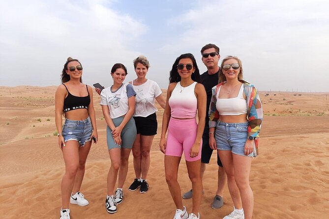 Dubai Desert Safari: Quad Bike, Camel Ride and BBQ Dinner - Sandboarding on the steep dunes